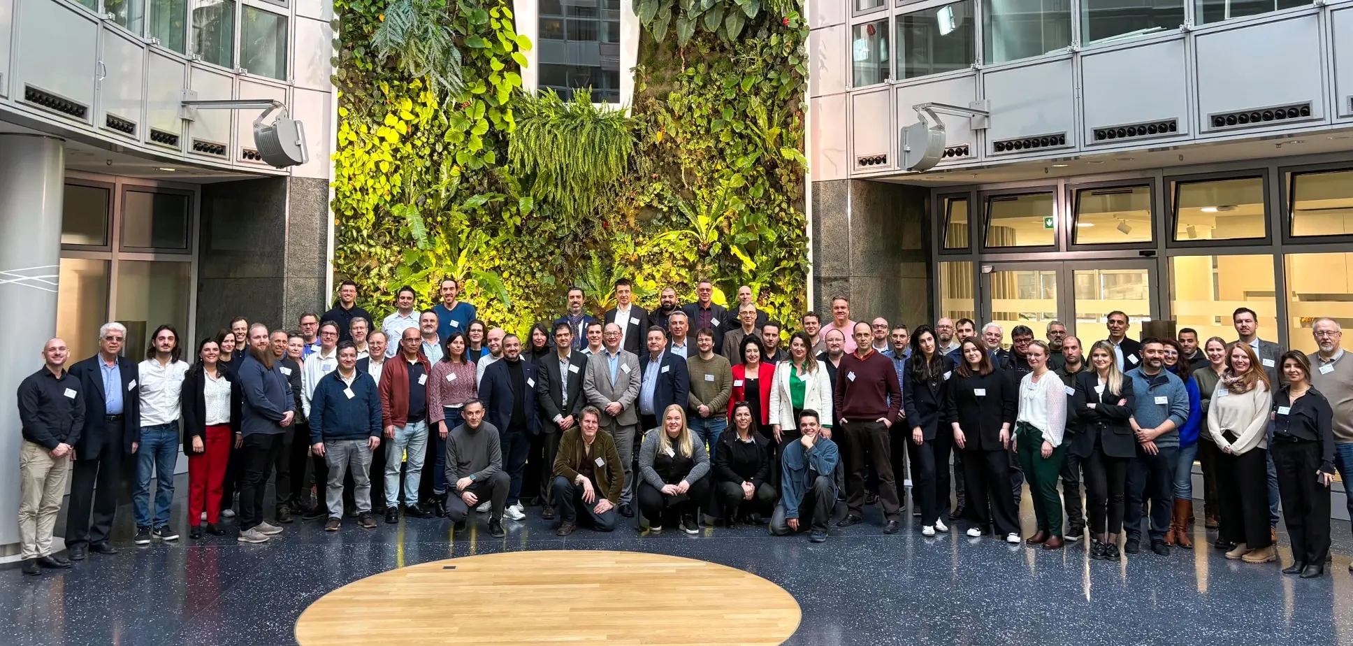 Representatives of various organisations involved on the DeployAI project, gathered on a large well-lit room, during the two-day inaugural meeting on 29 February – 1 March 2024, in Berlin, Germany.